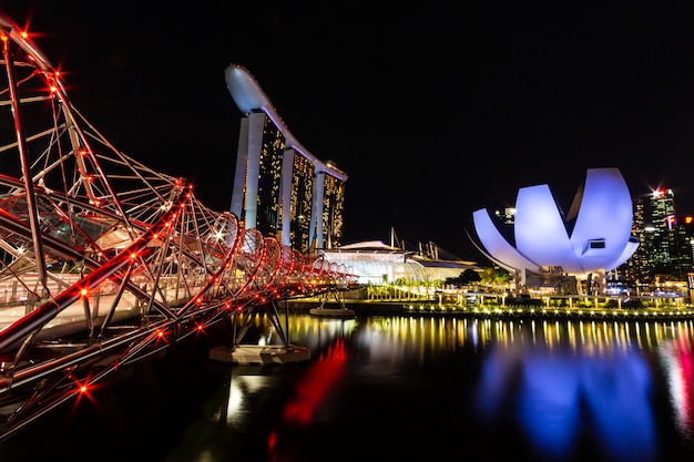 Singapore skyline cityscape around marina bay at night .