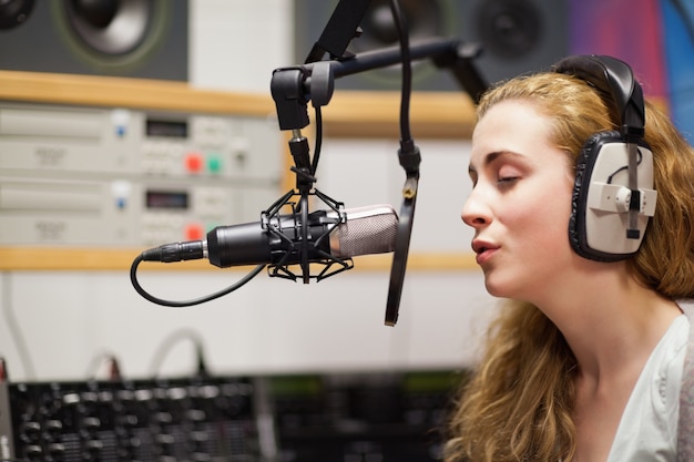 singer recording a track