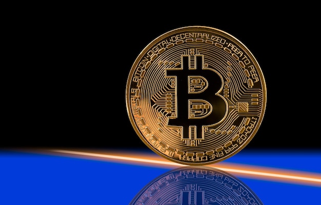 Single bitcoin with black background