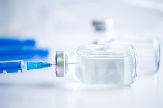 A single bottle vial of covid19 vaccine medical concept vaccination hypodermic injection treatment vaccine and syringe injection