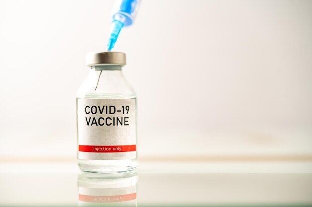 A single bottle vial of Covid19 vaccine Medical concept vaccination hypodermic injection treatment Vaccine and syringe injection