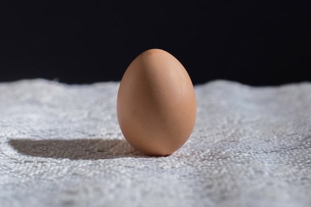 Single egg on a black background