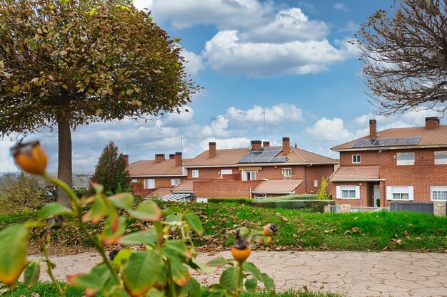 Single-family homes with solar panels on the roof.