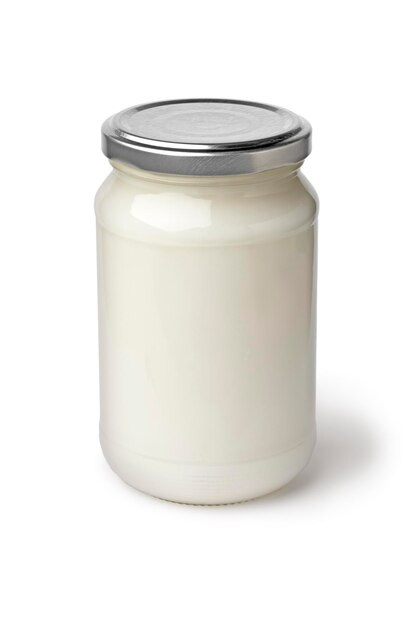 Single glass jar with coconut oil on white background