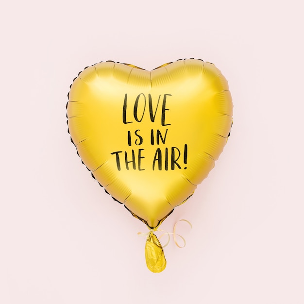 Single gold Foil Balloon of heart shaped. Love concept. Holiday celebration. Valentine's Day or birthday/bachelorette party decoration. Metallic balloon