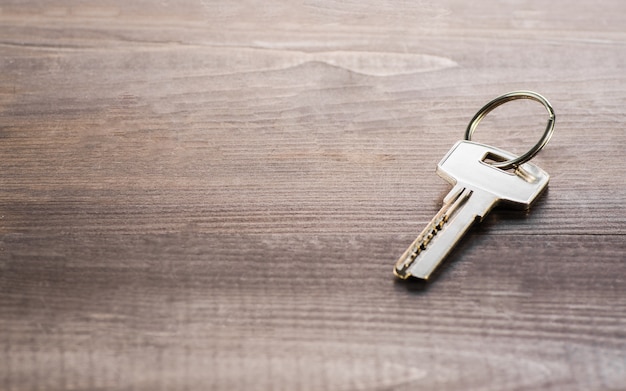 Single key on a wooden Board