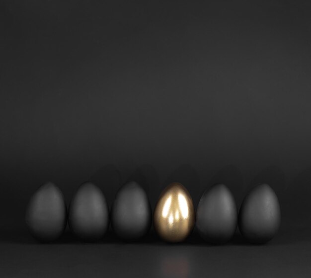 A single light is in a row of eggs.