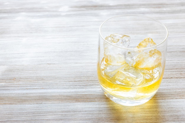 Single malt scotch whisky on the rocks on n table