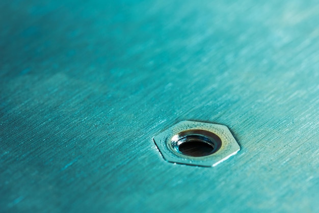 Photo single nut in metal surface texture