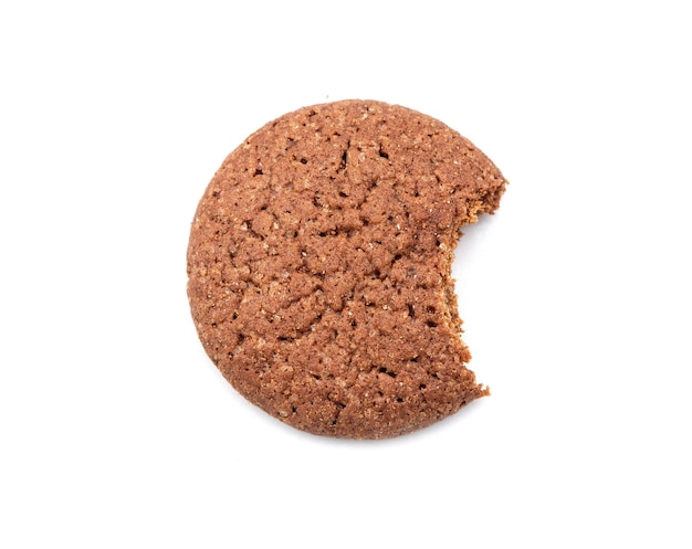 Single round ginger biscuit with crumbs and bite missing isolated on white