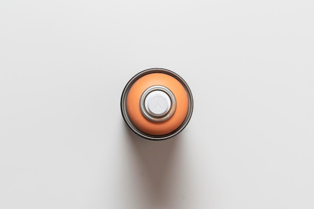 A single simple spray paint can isolated on colorful background