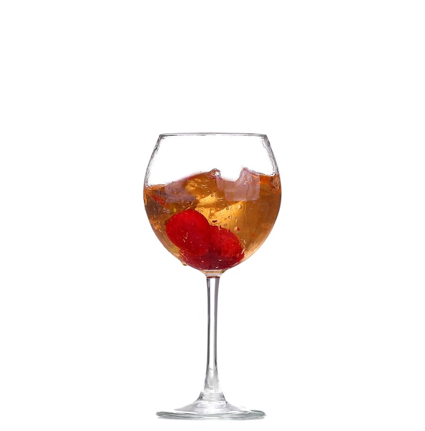 Single Strawberry splashing into a glass of wine