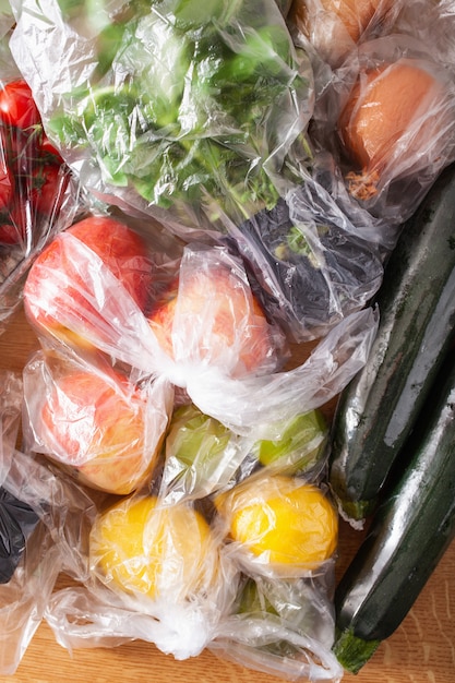 Single use plastic waste issue. fruits and vegetables in plastic bags