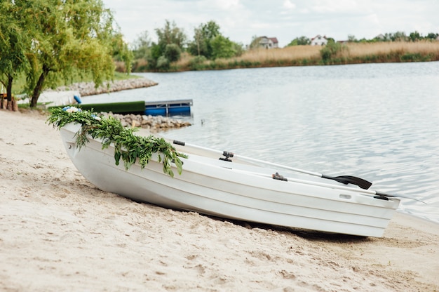 Single white boat on the river