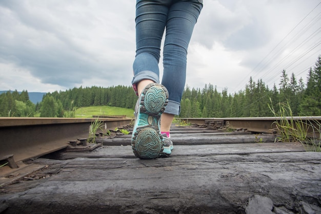 Single woman travaler walk on railways