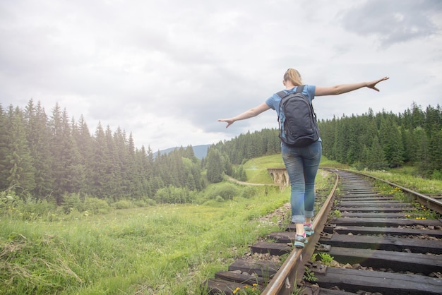 Single woman travaler walk on railways