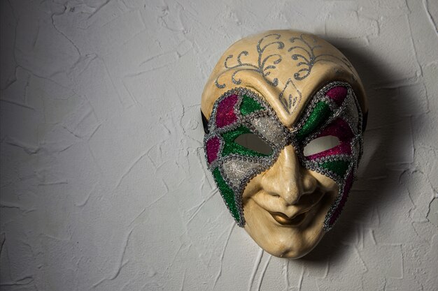 Sinister Joker mask n white wall