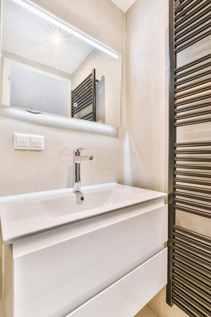 Sink and mirror in modern bathroom