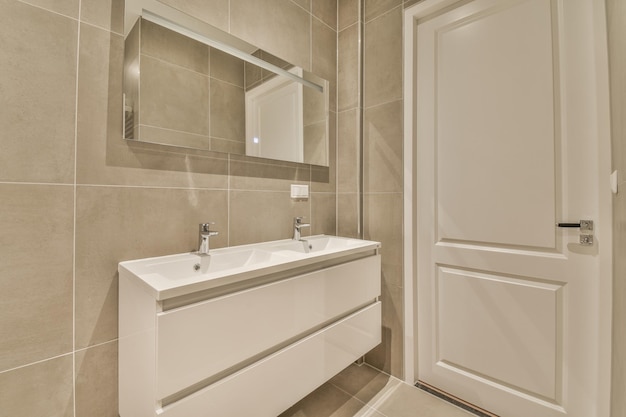 Sink and mirror near bathroom door