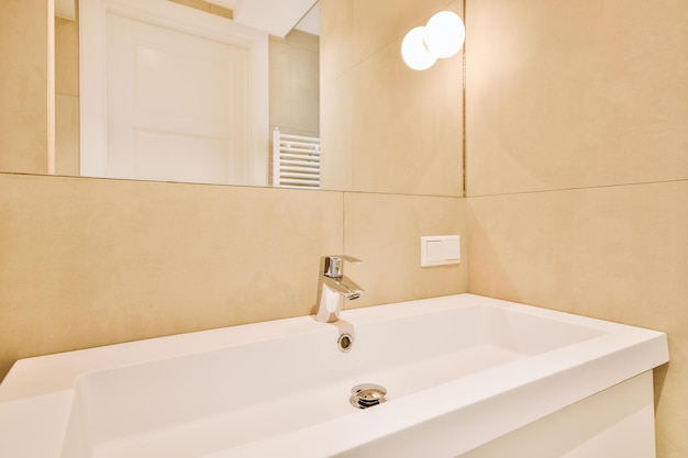 Sink and mirror near bathroom door