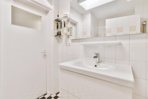 Sink and mirror near bathroom door