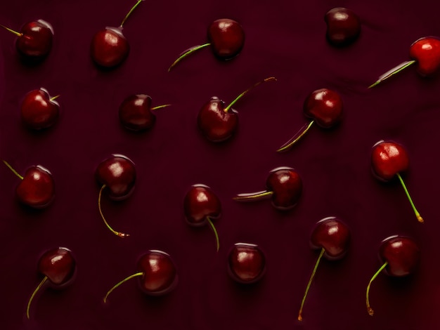 Photo sinking sweet cherries pattern, flat lay