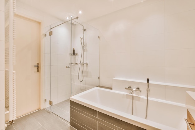 Sinks and bathtub near shower cabin