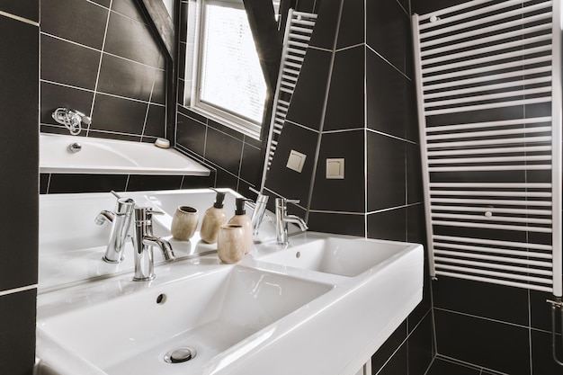 Sinks and bathtub near shower cabin