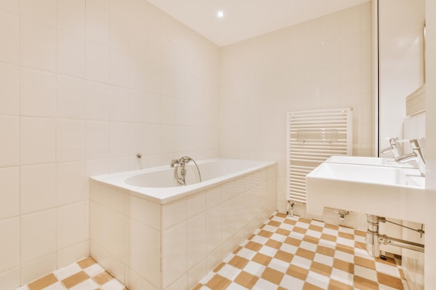 Sinks and bathtub near shower cabin