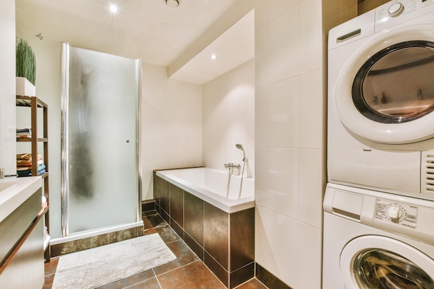 Sinks and bathtub near shower cabin