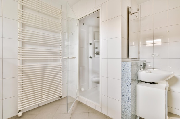 Photo sinks and bathtub near shower cabin