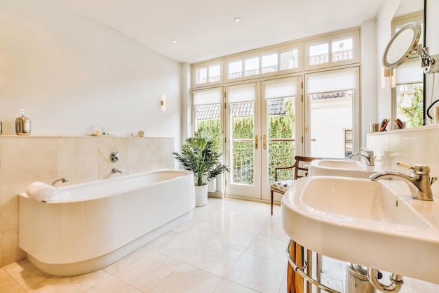 Sinks and bathtub near shower cabin