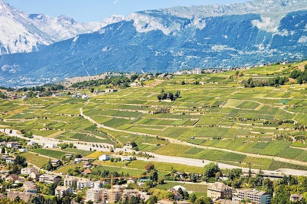 Sion cityscape in Rhone valley and Bernese Alps mountains, capital of Valais canton, Switzerland