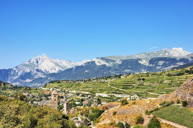 Sion cityscape and valley, and Bernese Alps mountains, Valais canton, Switzerland