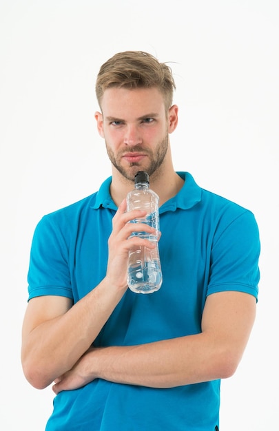 Sip of freshness after great workout. Man athlete hold water bottle. Athlete drink water after training. Man athlete hold bottle. Sportsman care hydration body. Athlete healthy lifestyle concept.