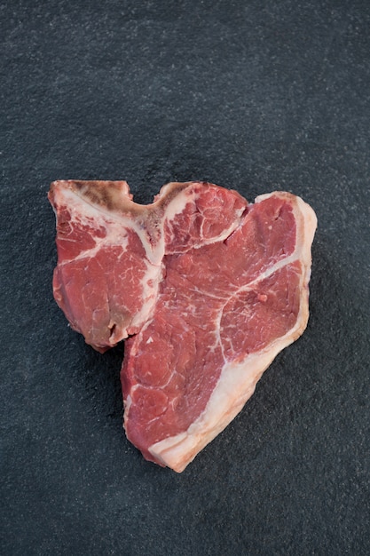 Sirloin chop against black surface