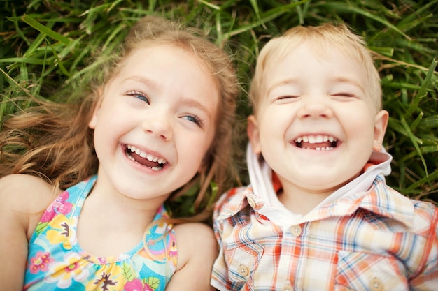 Sister and brother kids laughing Top view