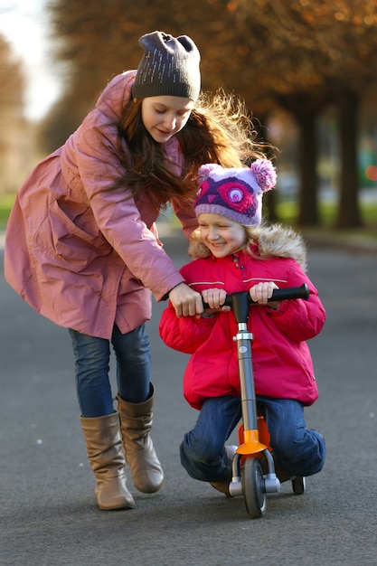 Sister girls walking on the street