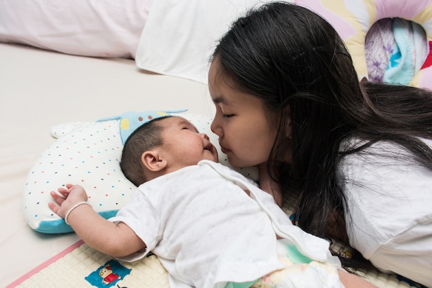 Sister take care her sister on the bed