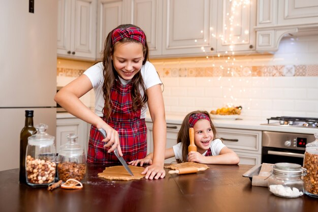 sisters at home cooking together