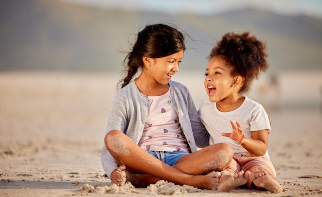 Sisters make the best friends in the world Shot of two sisters spending time together at the beach