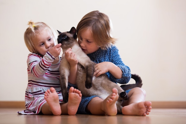 sisters  with cat 