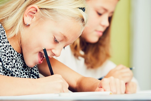Sisters writing homework at home