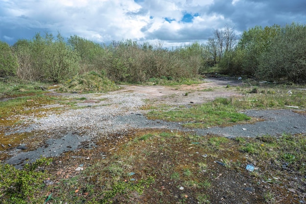 Site of former gas works, now derelict and overgrown after many years of disuse.