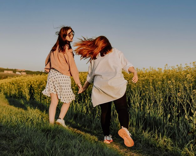 siters hugging and enjoying outdoor activity