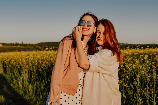 siters hugging and enjoying outdoor activity