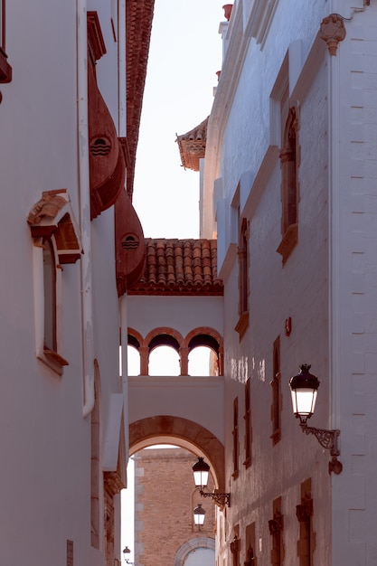 Sitges narrow street with sunlight