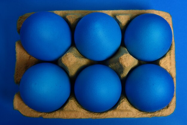 Six blue painted Easter eggs