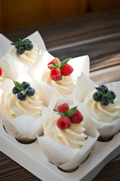 Six cream cake cones with berries 3301