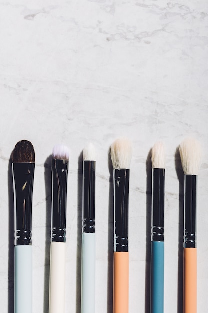 Six makeup brushes laying together.